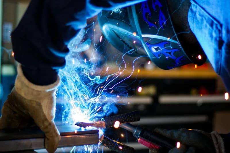 A welder at work, sparks flying