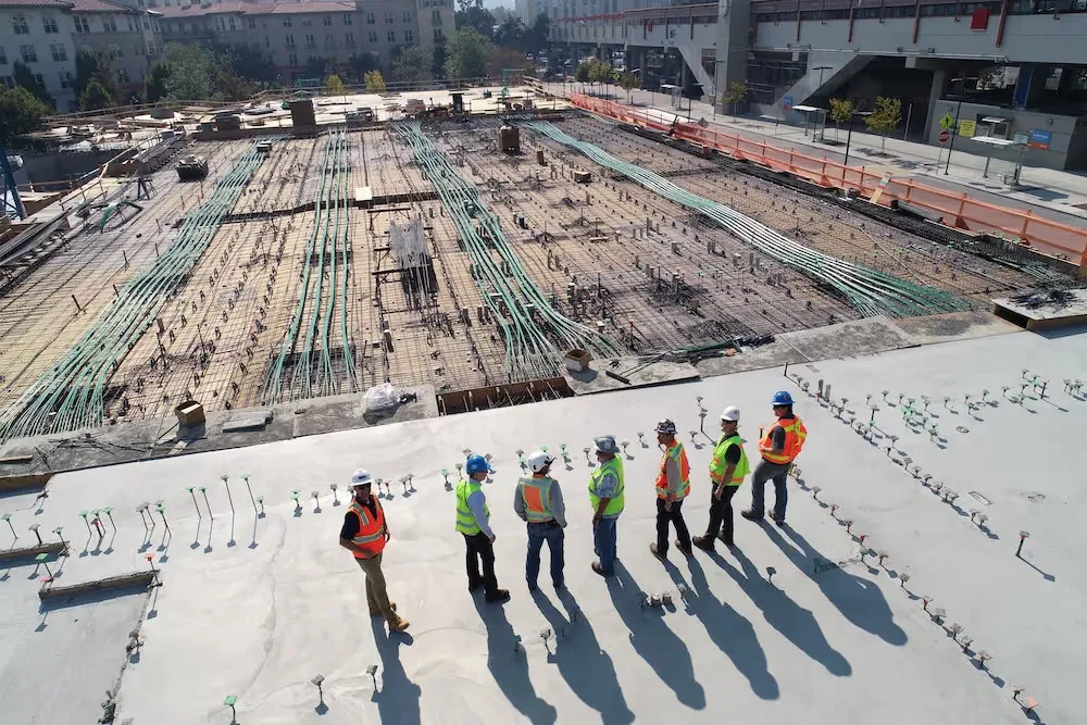 Construction workers looking out over the site